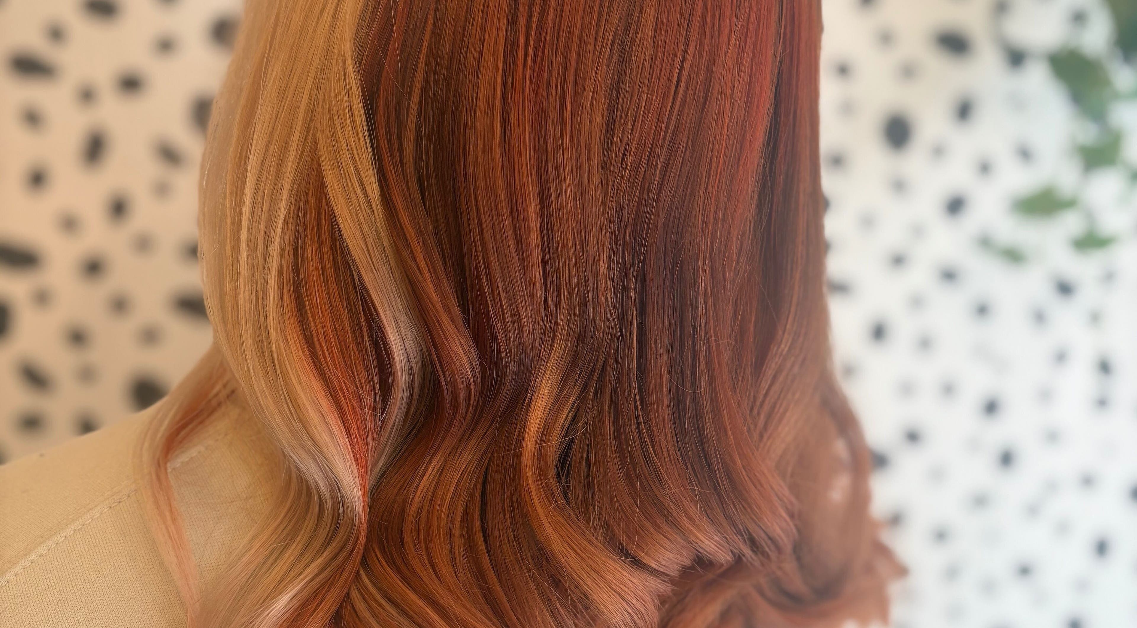 Elegant red hair waves styled professionally at Justine’s Hair and Barbering, Elgin, Scotland, GB.