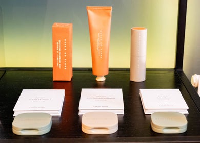 Luxurious skincare display at Studio Luune, London, England, GB featuring vibrant tubes and elegant packaging.
