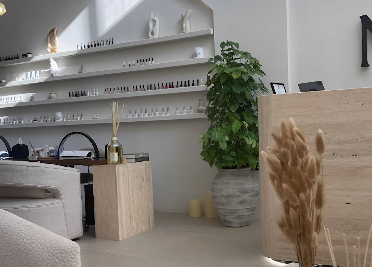 Elegant interior of Nola Head Spa and Salon in Riyadh, Riyadh Province, SA with sleek decor and greenery.
