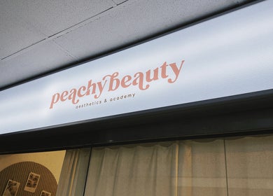 Exterior of HIME STUDIO / He Mēi “姫” in Singapore, SG, featuring Peachy Beauty Aesthetics & Academy sign.