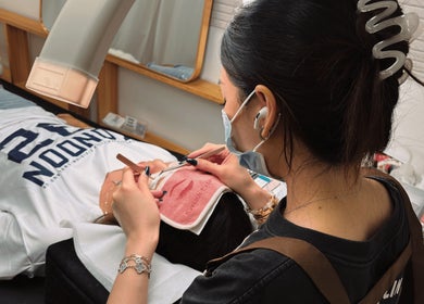 Technician performing precision beauty treatment at HIME STUDIO / He Mēi “姫” Singapore, SG.