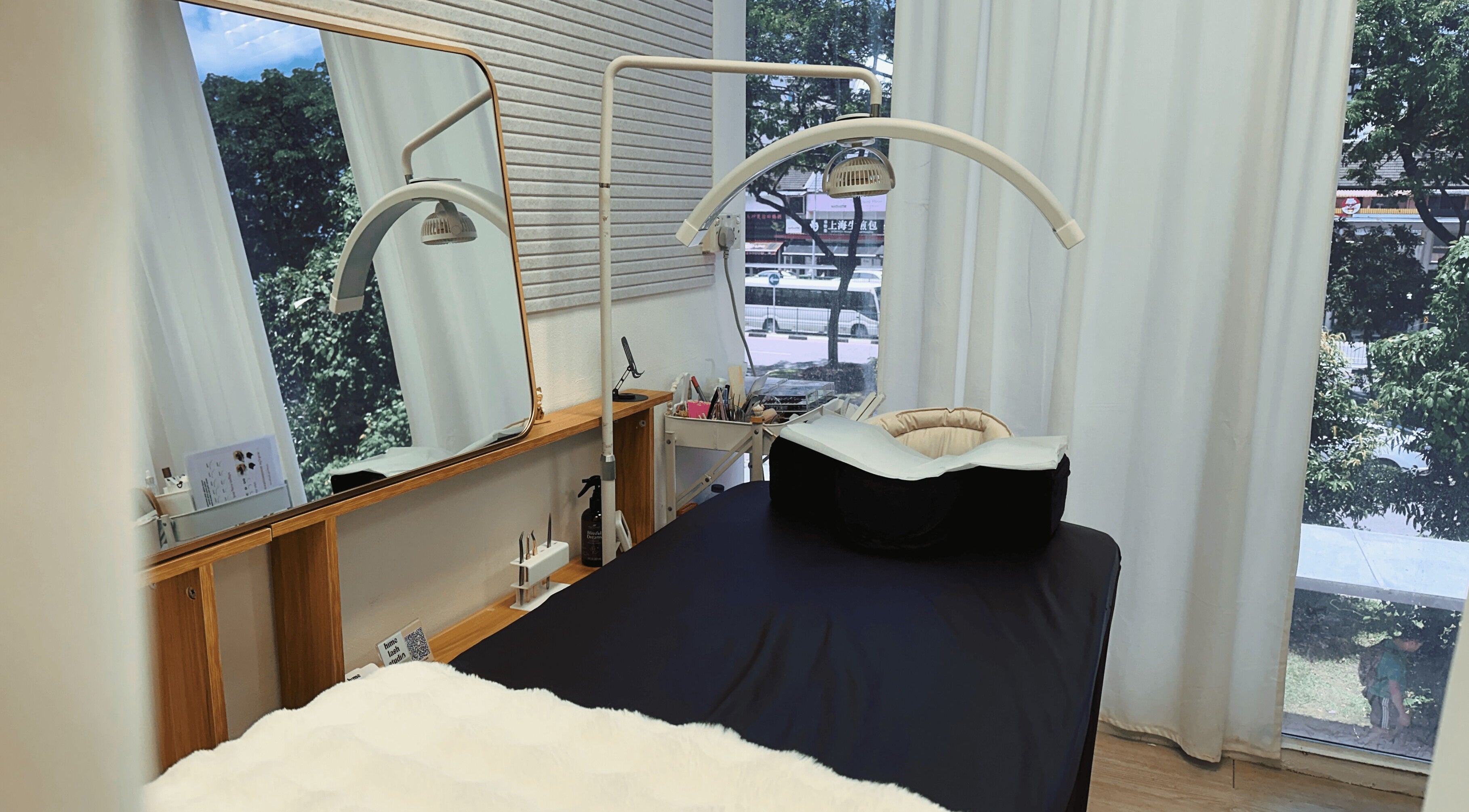 Hime Studio / He Mēi “姫”, Singapore, SG. A tranquil treatment room with a comfy bed and large mirror.