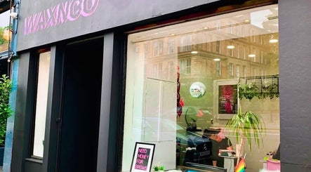 Front view of Enhanced Aesthetics Scotland in Glasgow, Scotland, GB featuring stylish exterior and window decor.