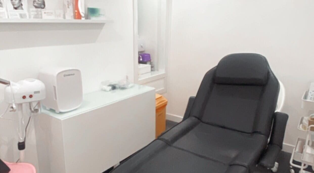 Modern treatment room at Enhanced Aesthetics Scotland, Glasgow, Scotland, GB, featuring a sleek chair.