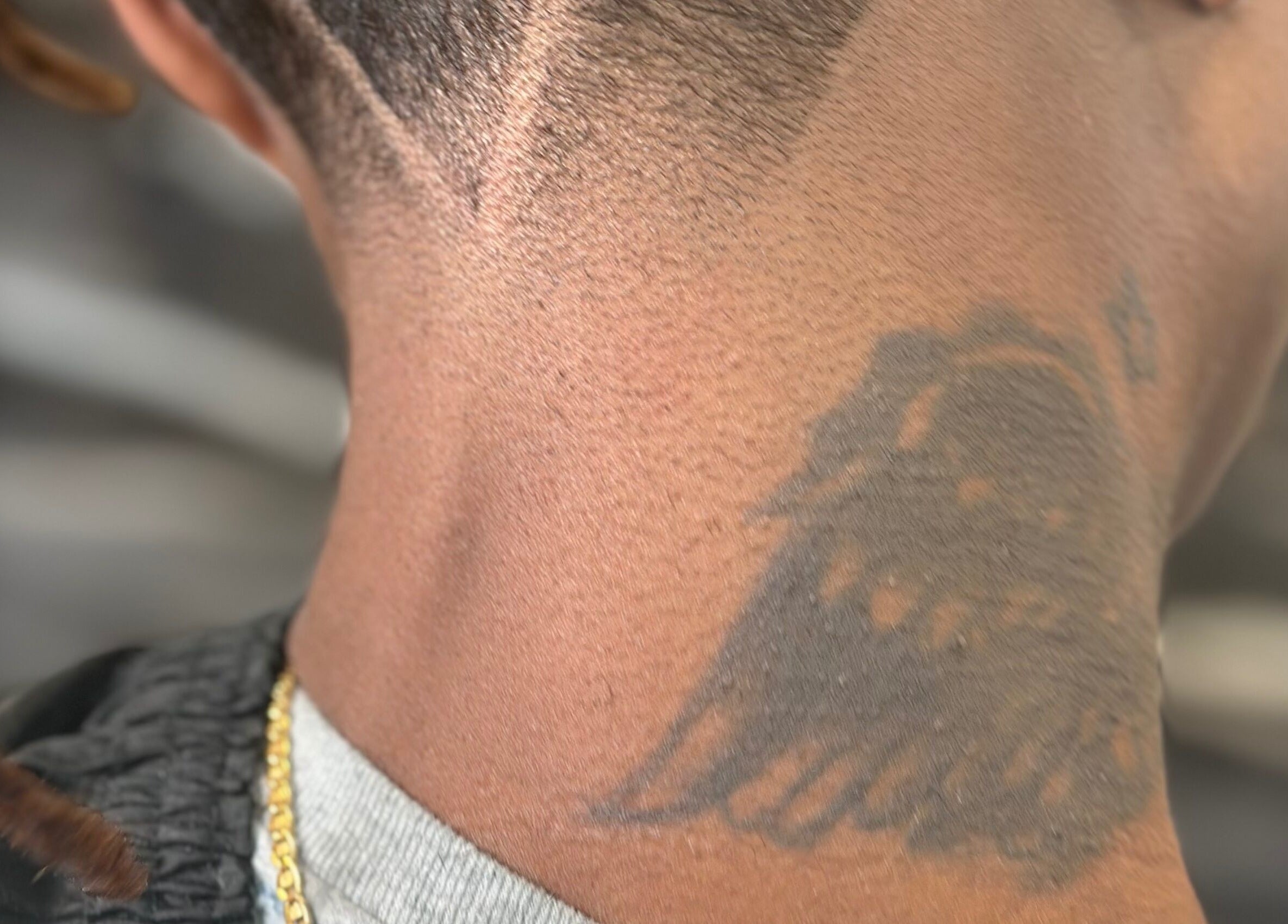 Detailed neck tattoo design showcased at THE GRO GALLERY. INC., Shelby, North Carolina, US.