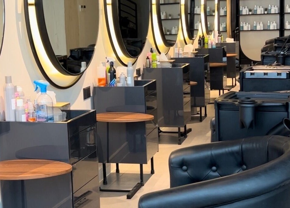 Modern interior of Lilyas Beauty Salon, Al Khobar, Eastern Province, SA, showcasing styling stations and chairs.