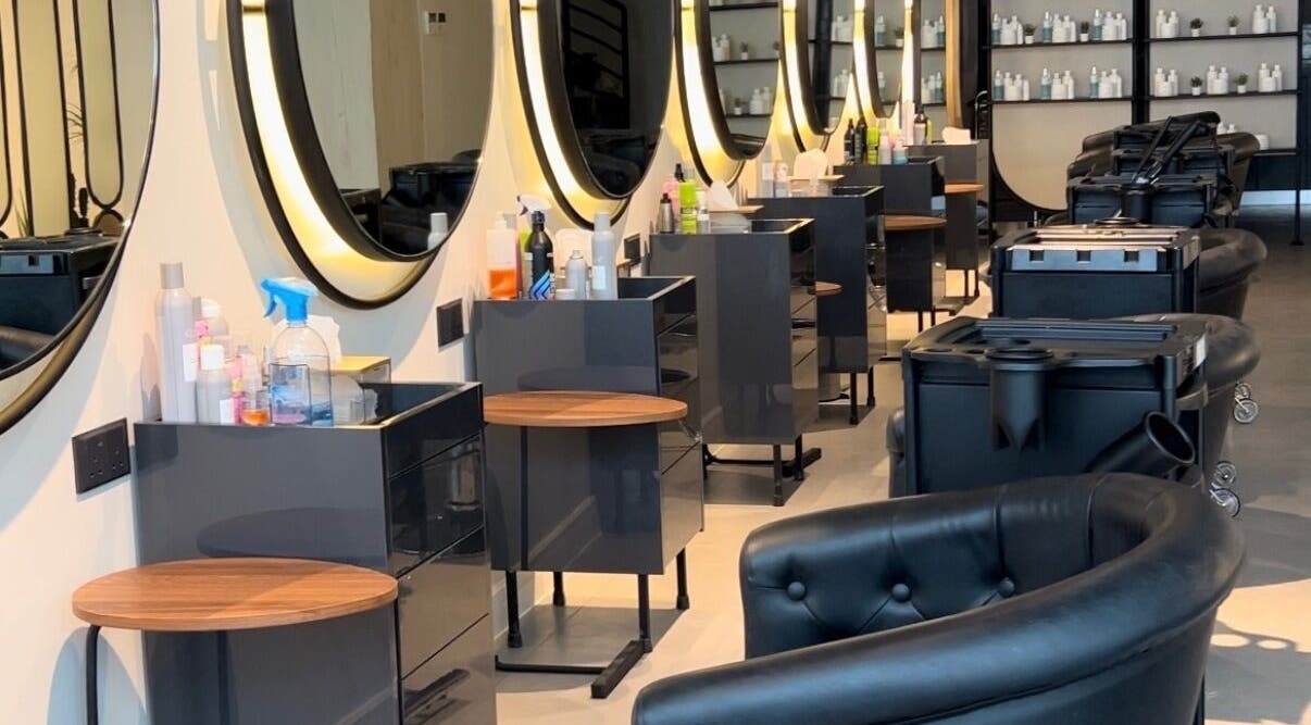 Modern interior of Lilyas Beauty Salon, Al Khobar, Eastern Province, SA, showcasing styling stations and chairs.