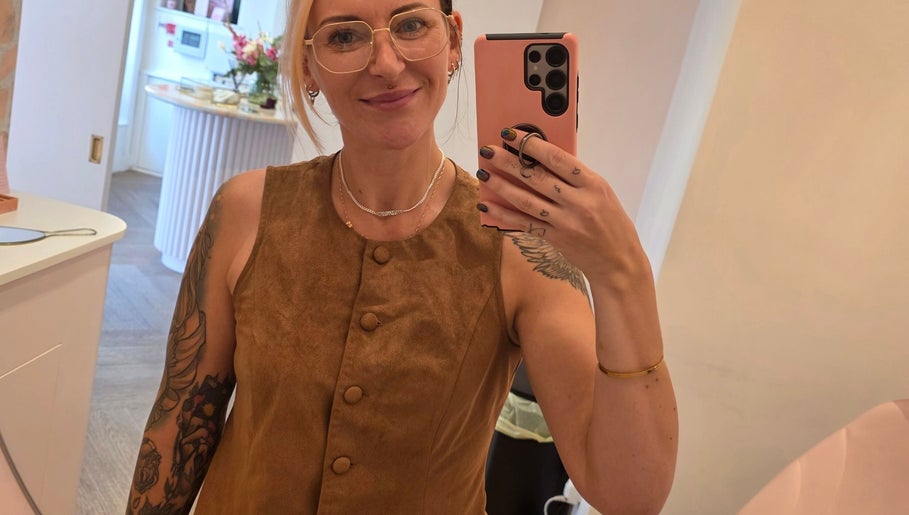 Person taking a mirror selfie at Thirteen Roses Piercing 🥀 Broxburn, Scotland, GB, showcasing interior decor.