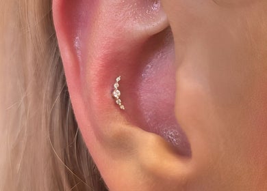 Elegant ear piercing at Thirteen Roses • Piercing by Danielle in Broxburn, Scotland, GB showcasing delicate design.