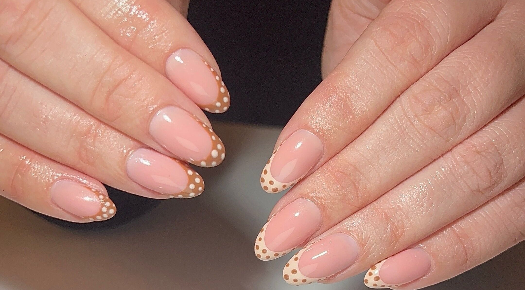 Polka dot nail art design at Dunn Up By Alexandra in Middlesbrough, England, GB, showcasing delicate craftsmanship.