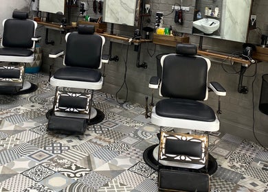 Elegant barber chairs at Broadway Barbershop, Ultimo, NSW, AU, featuring vintage design and comfort.