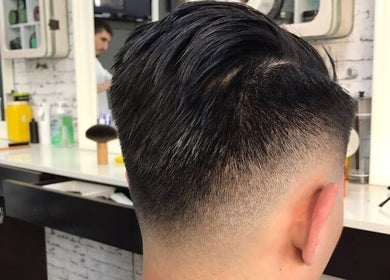 Modern fade haircut at Broadway Barbershop in Ultimo, NSW, AU showcasing expert styling skills.