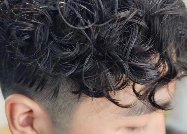 Close-up of textured curls styled at Highland Hair Salon, Melbourne, Victoria, AU.