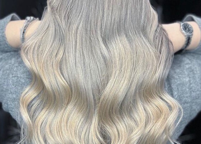 Blonde wavy hairstyle crafted at Highland Hair Salon, Melbourne, Victoria, AU.