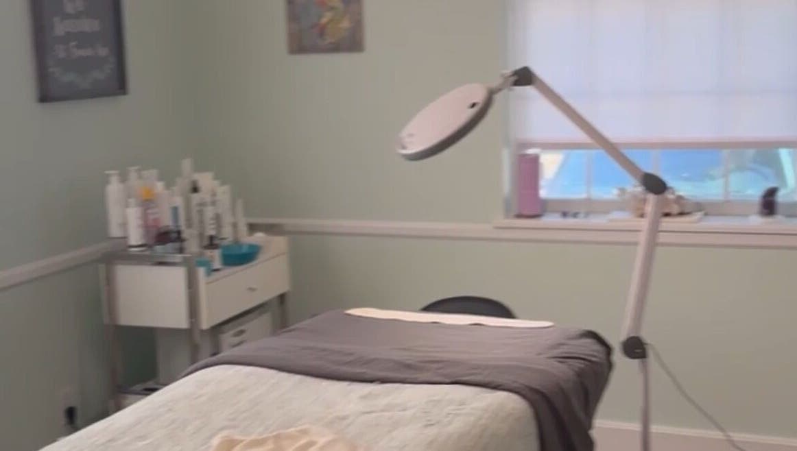 Treatment room at The Skin Institute, Ocean Springs, Mississippi, US, featuring a relaxation bed and equipment.