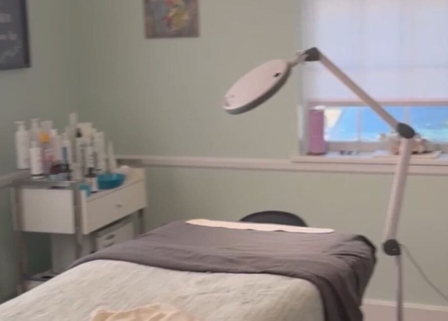 Treatment room at The Skin Institute, Ocean Springs, Mississippi, US, featuring a relaxation bed and equipment.