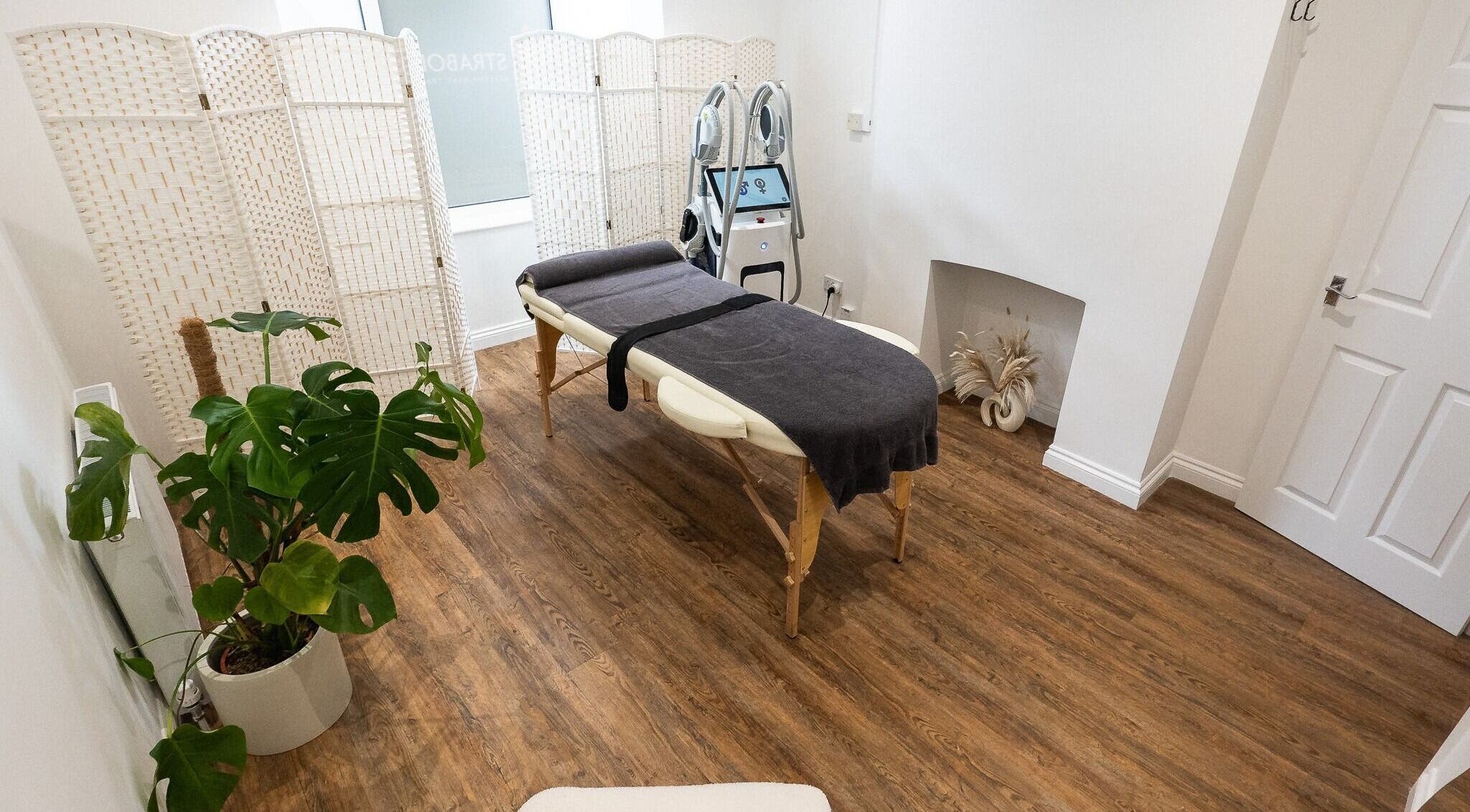 Massage room at Astra Body, Chandler's Ford, England, GB with a treatment table and calming decor.