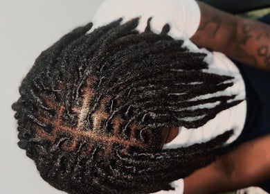 Intricate dreadlock style at Locced by Ny, Coventry, England, GB, showcasing skilled craftsmanship.