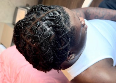 Detailed view of styled locs at Locced by Ny, Coventry, England, GB. Showcasing expert hairstyling.