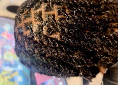 Intricate braided hairstyle at Locced by Ny, Coventry, England, GB.