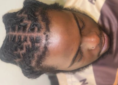 Close-up of intricate braids at Locced by Ny, Coventry, England, GB showcasing expert styling.
