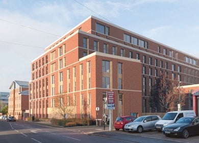 Street view of Locced by Ny, a beauty venue in a modern brick building in Coventry, England, GB.