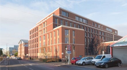 Street view of Locced by Ny, a beauty venue in a modern brick building in Coventry, England, GB.