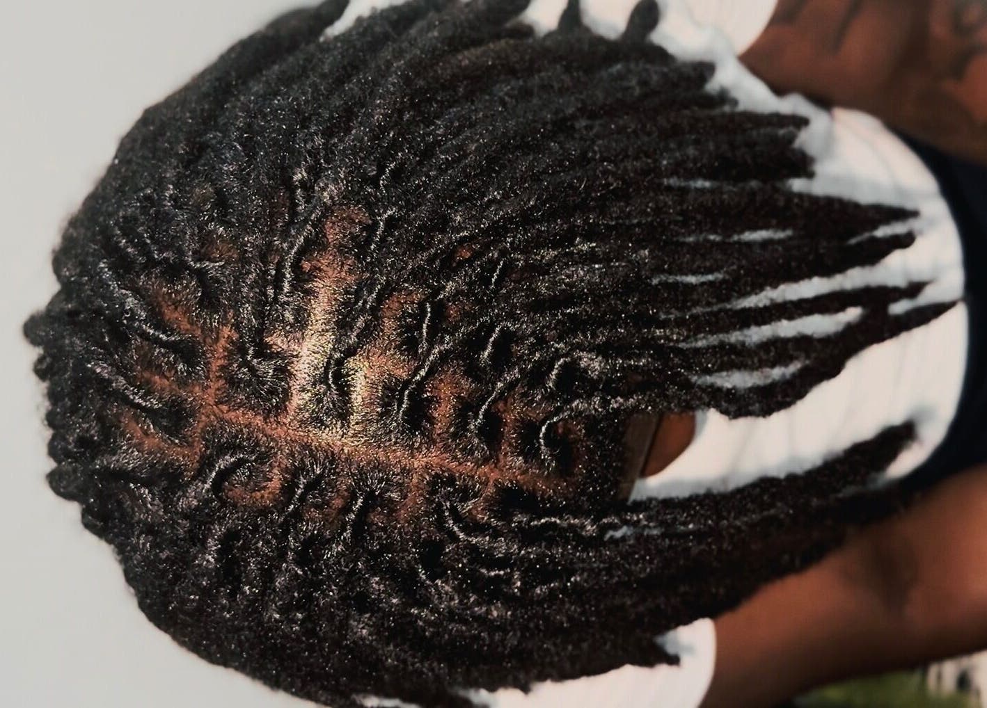 Freshly styled locs at Locced by Ny in Coventry, England, GB showcase intricate detailing.