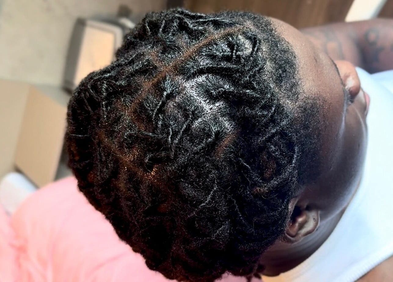 Close-up of stylish locs hairstyle at Locced by Ny, Coventry, England, GB.