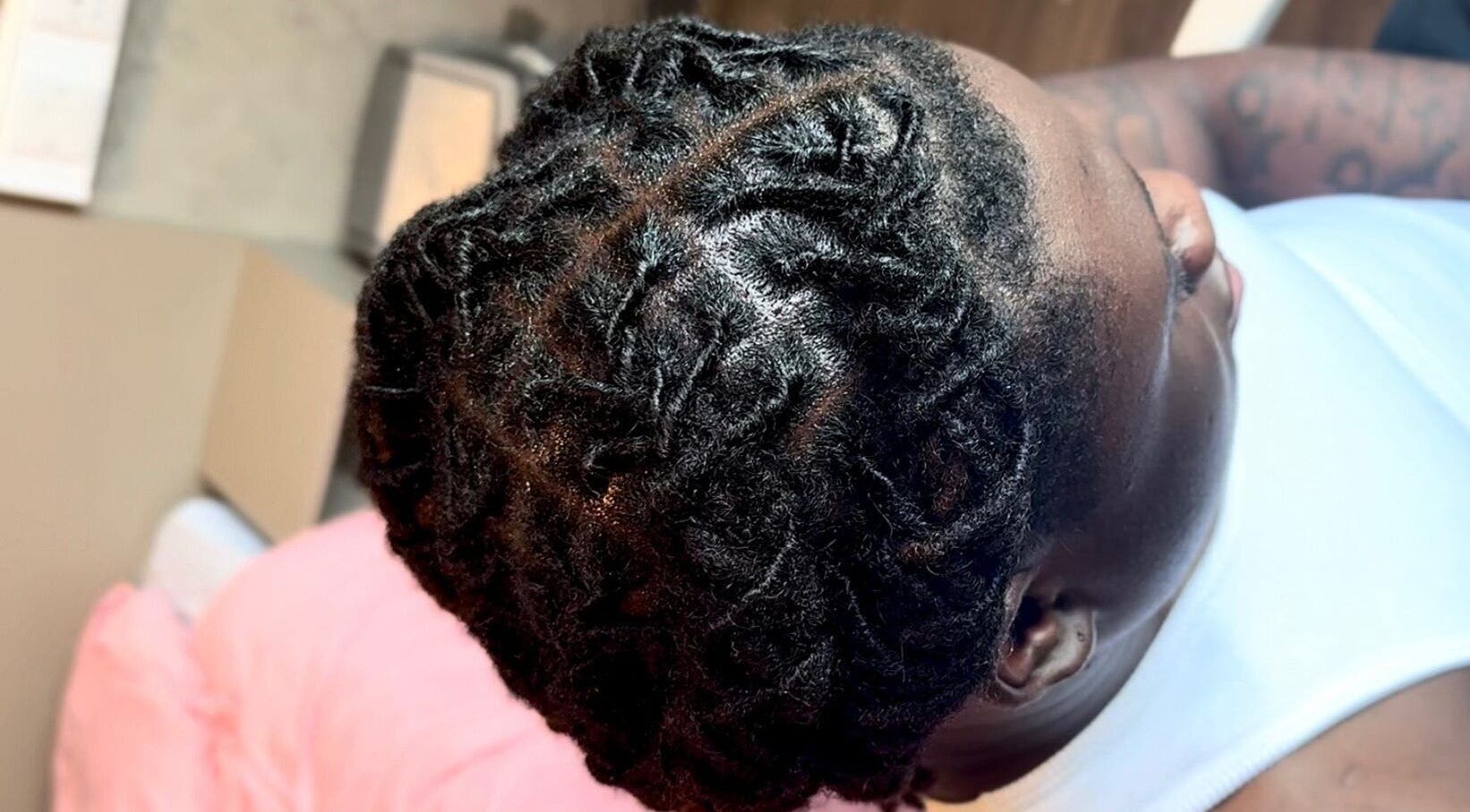 Close-up of stylish locs hairstyle at Locced by Ny, Coventry, England, GB.