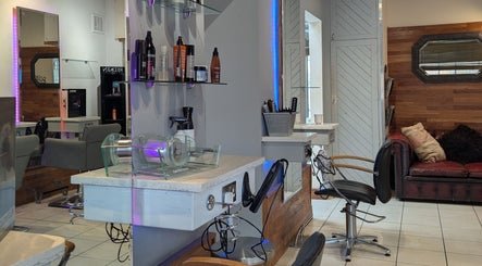 Modern styling area at Hair Workshop, Maidstone, England, GB, featuring sleek chairs and vibrant decor.