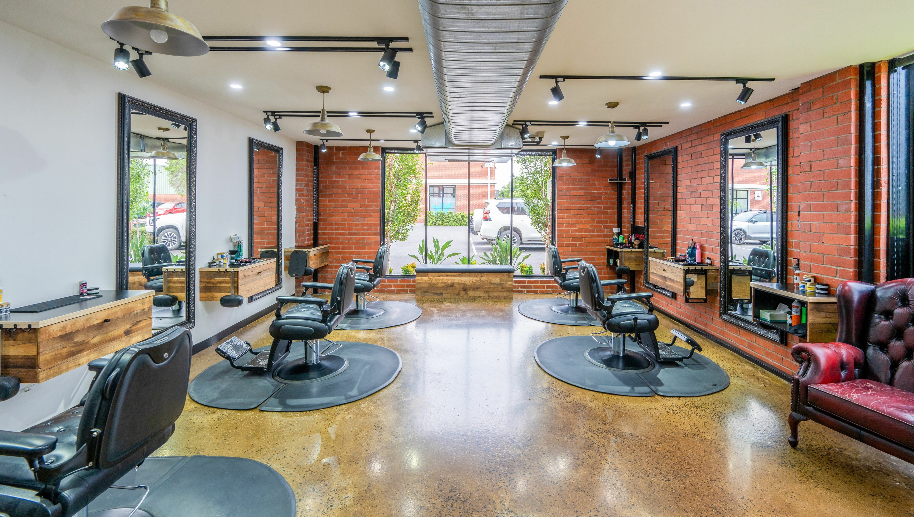 Spacious interior of Rex and Ross Barber - Newtown, showcasing stylish barber chairs, Newtown, Victoria, AU.
