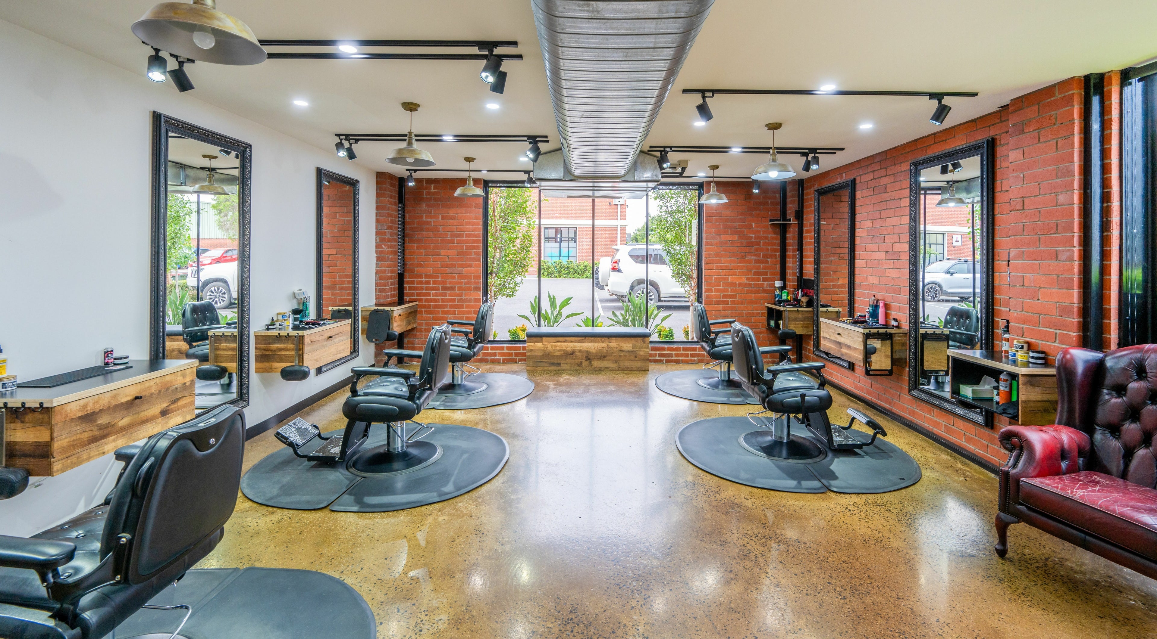 Spacious interior of Rex and Ross Barber - Newtown, showcasing stylish barber chairs, Newtown, Victoria, AU.