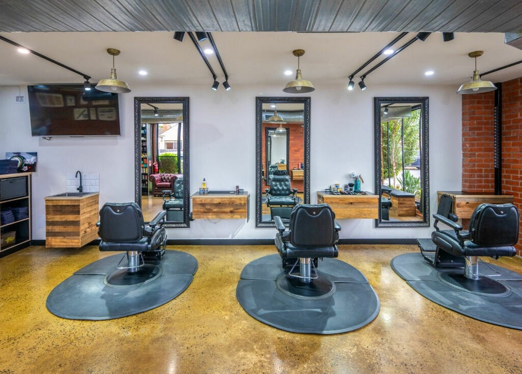 Rex and Ross Barber - Newtown features stylish black chairs and mirrors in Newtown, Victoria, AU.