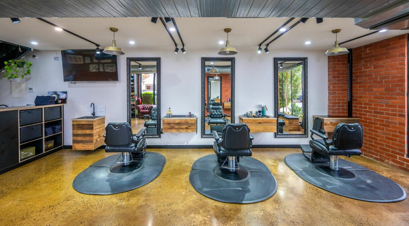 Rex and Ross Barber - Newtown features stylish black chairs and mirrors in Newtown, Victoria, AU.