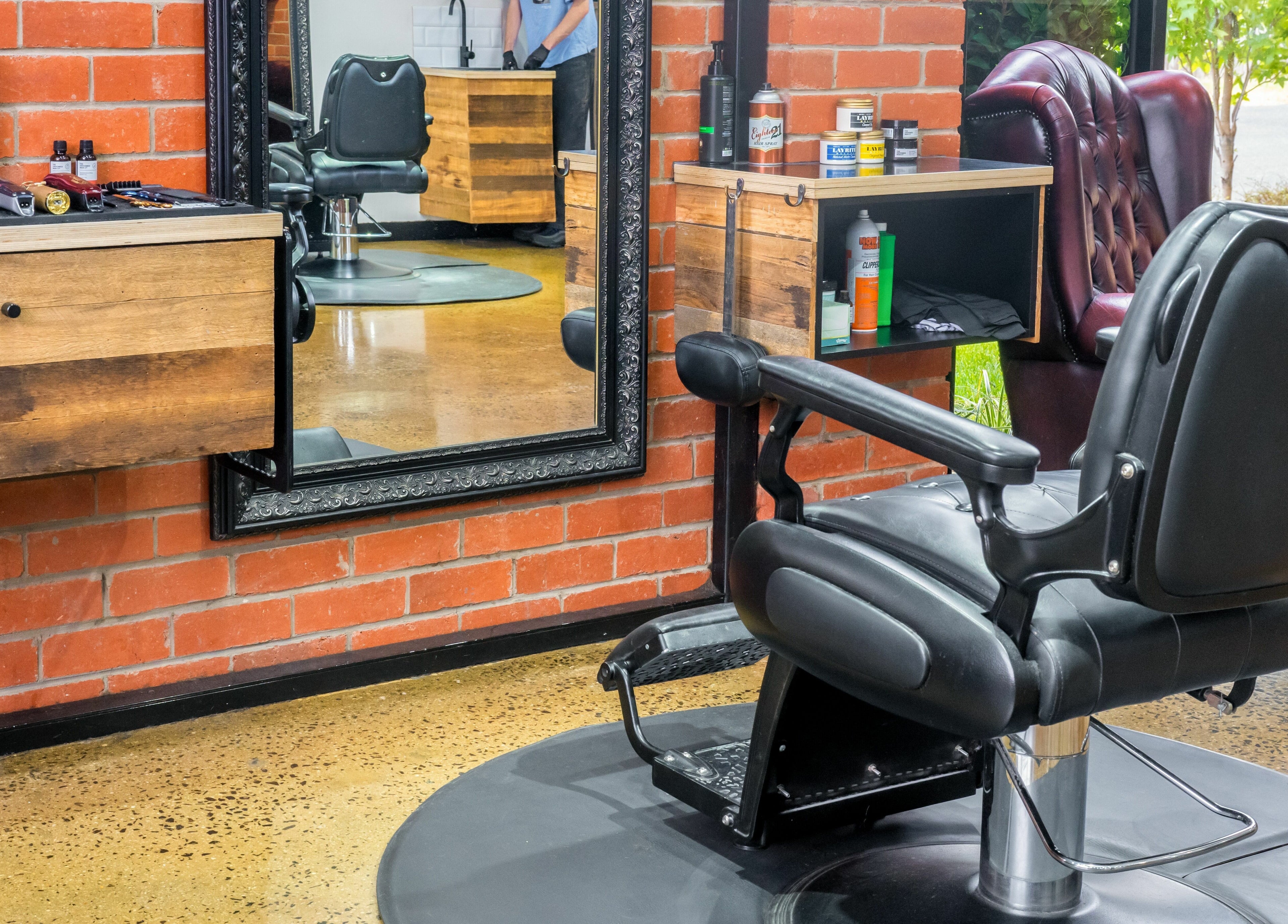 Interior of Rex and Ross Barber - Newtown, featuring a stylish chair and mirror setup in Newtown, Victoria, AU.