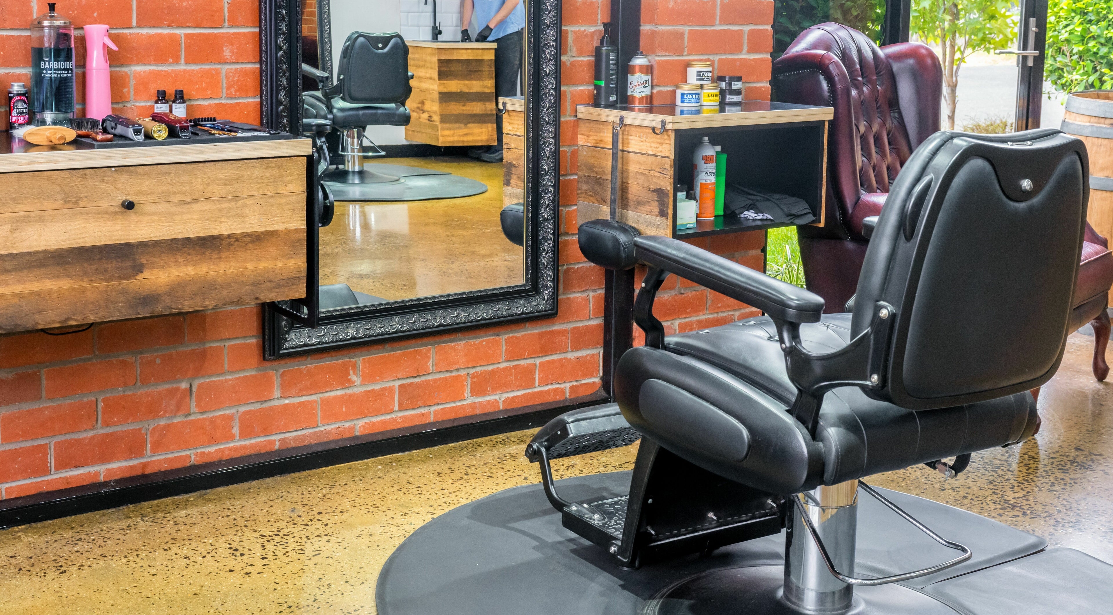 Interior of Rex and Ross Barber - Newtown, featuring a stylish chair and mirror setup in Newtown, Victoria, AU.