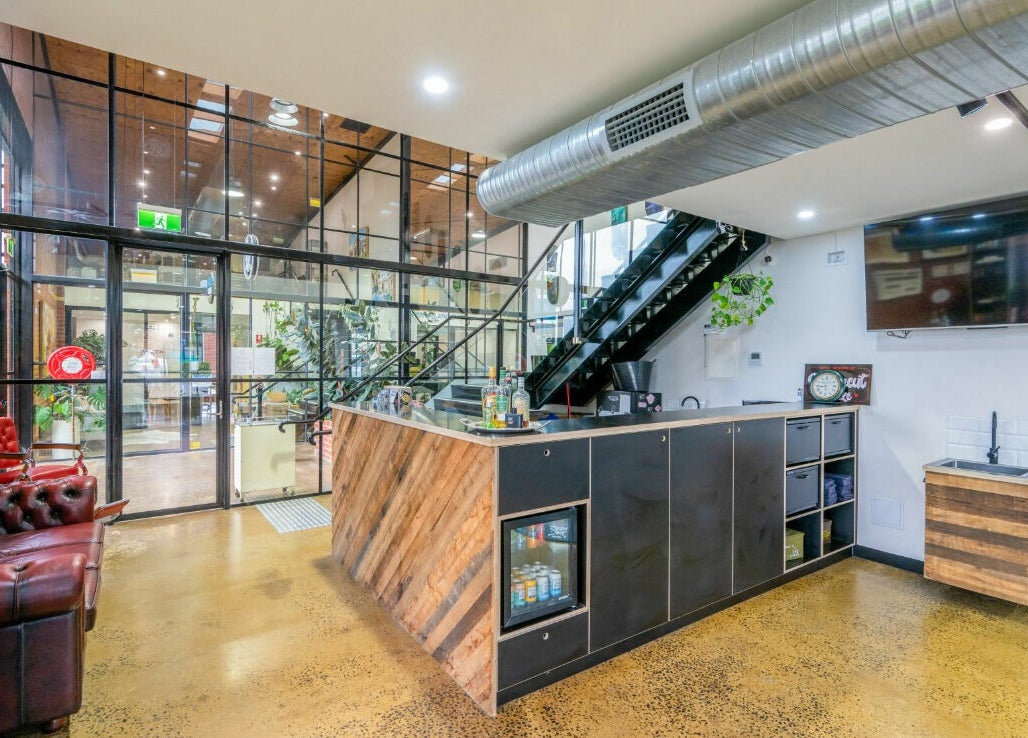 Stylish interior of Rex and Ross Barber - Newtown in Newtown, Victoria, AU with modern seating and decor.