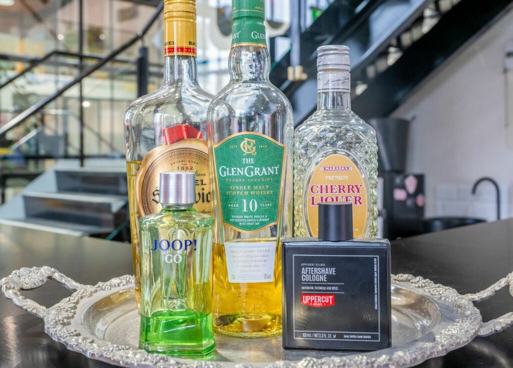 Selection of premium beverages and cologne at Rex and Ross Barber - Newtown, Victoria, AU.