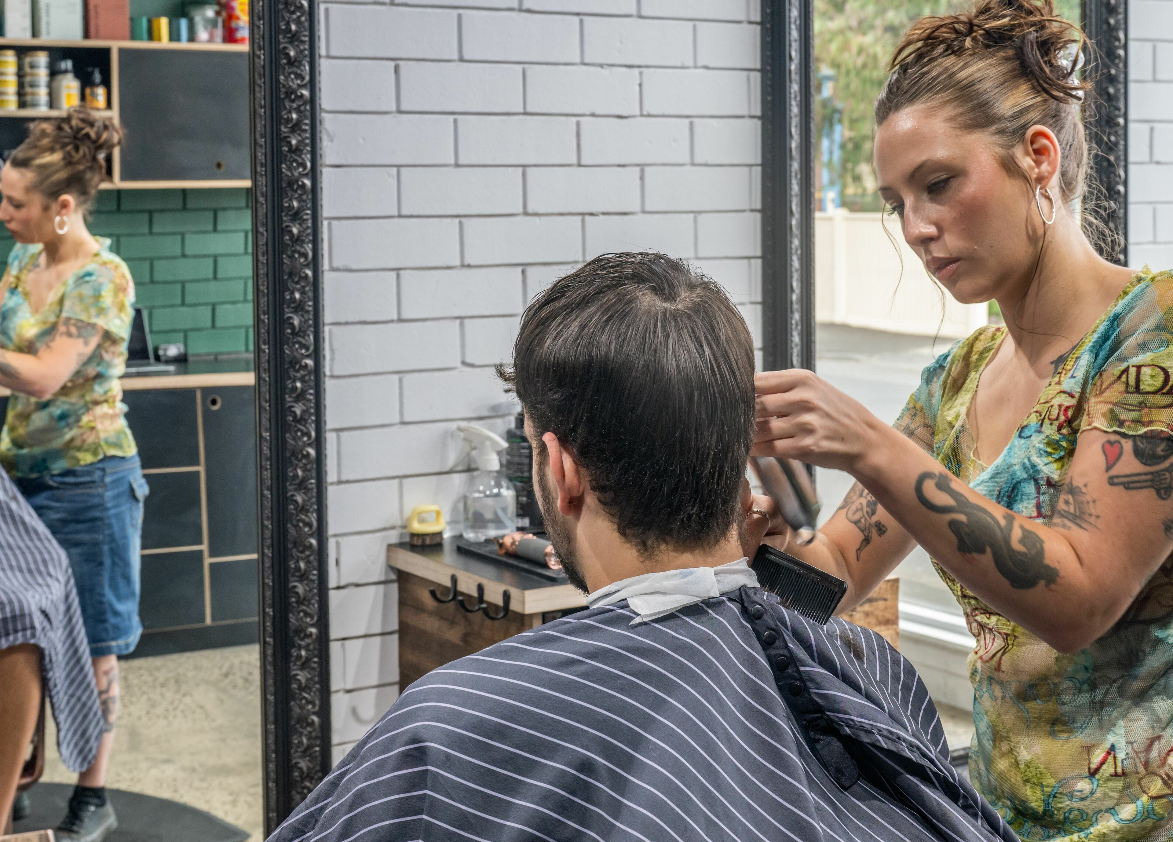 Expert stylist at Rex and Ross Barber - Geelong West, Victoria, AU delivers precision haircut.