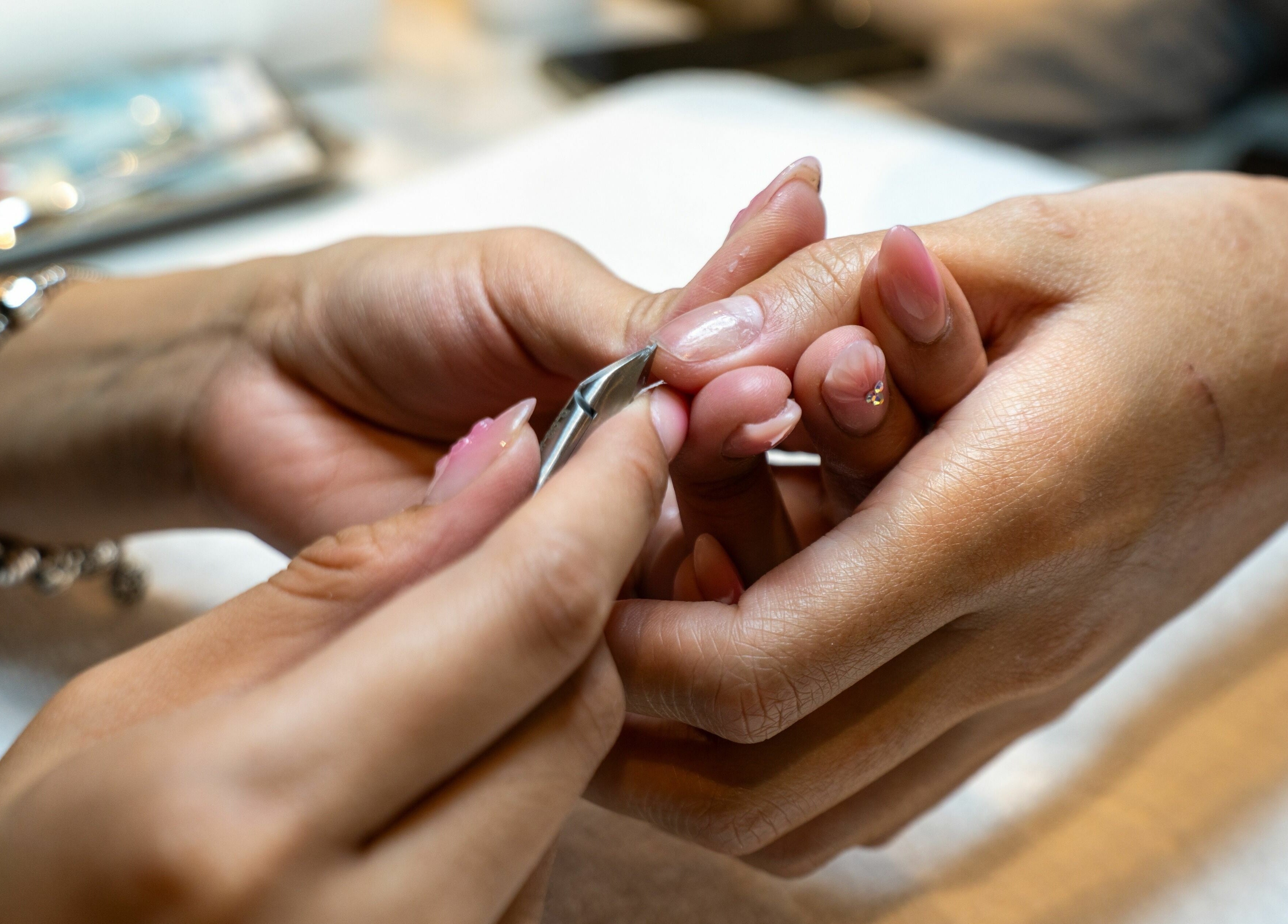 Nail grooming in progress at Champagne Nail Lounge at the Quay, New Westminster, British Columbia, CA.