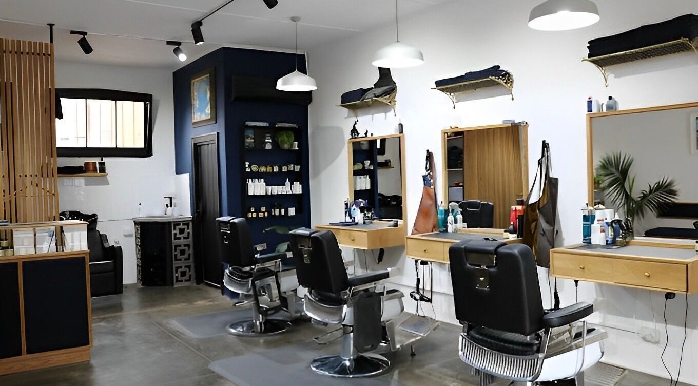 Stylish interior of The Conductor Barbershop Carnegie, featuring chic barber chairs in Carnegie, VIC, AU.