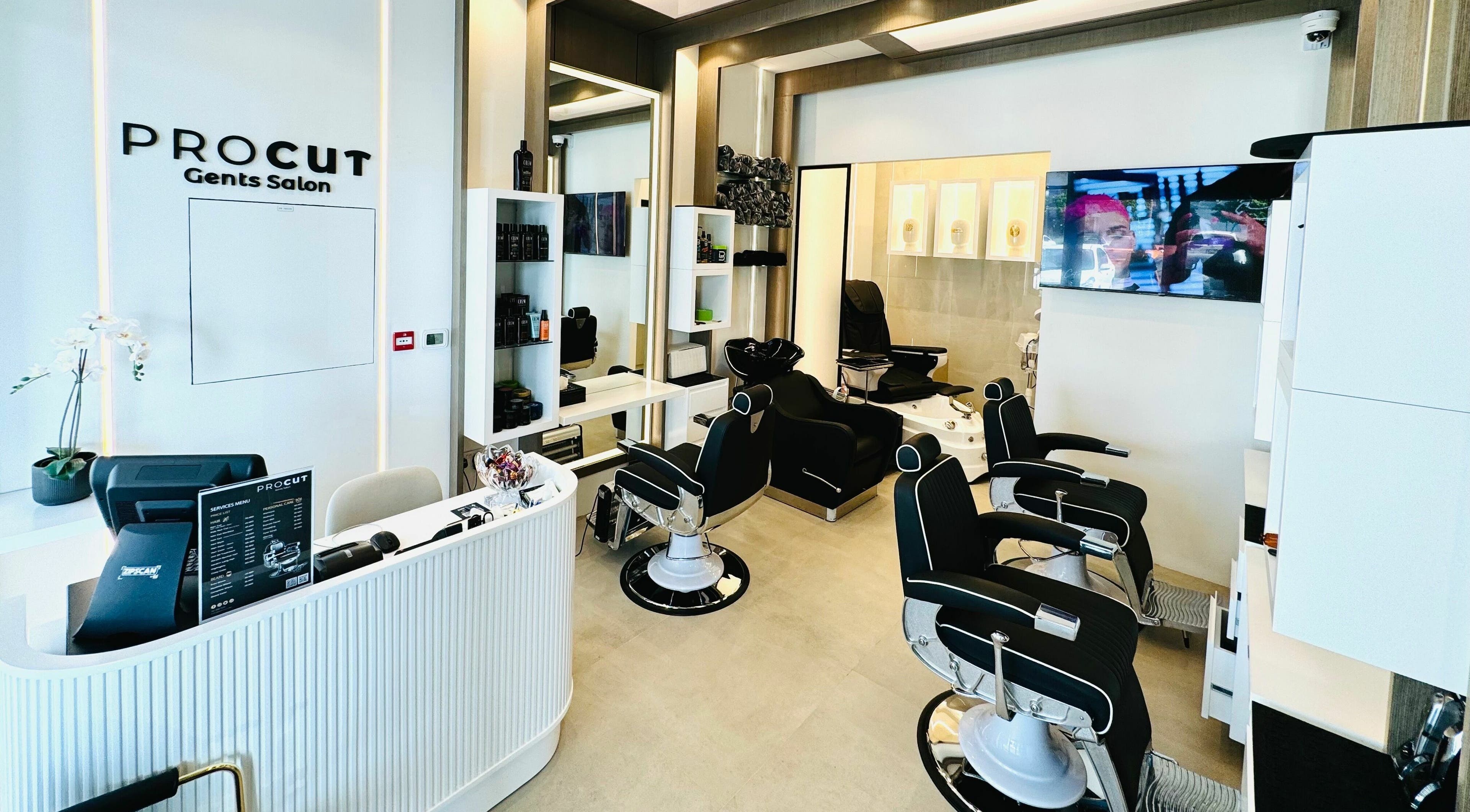 Modern interior of Procut Gents Salon in دبي, دبي, AE featuring sleek barber chairs and a minimalist desk.