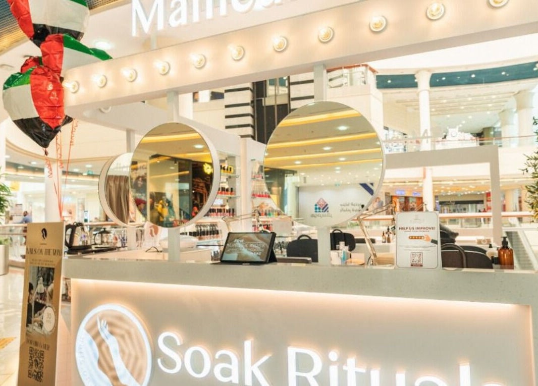 Nails Rituals Kiosk For Him & Her, a chic venue in Abu Dhabi, AE, inside a bustling shopping mall.