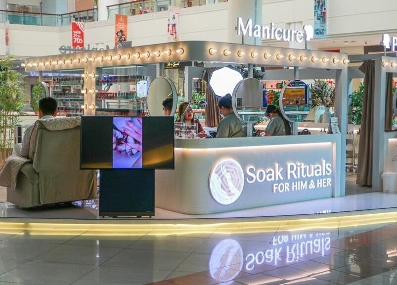 Nails Rituals Kiosk For Him & Her in Abu Dhabi, featuring cozy seating and vibrant decor.