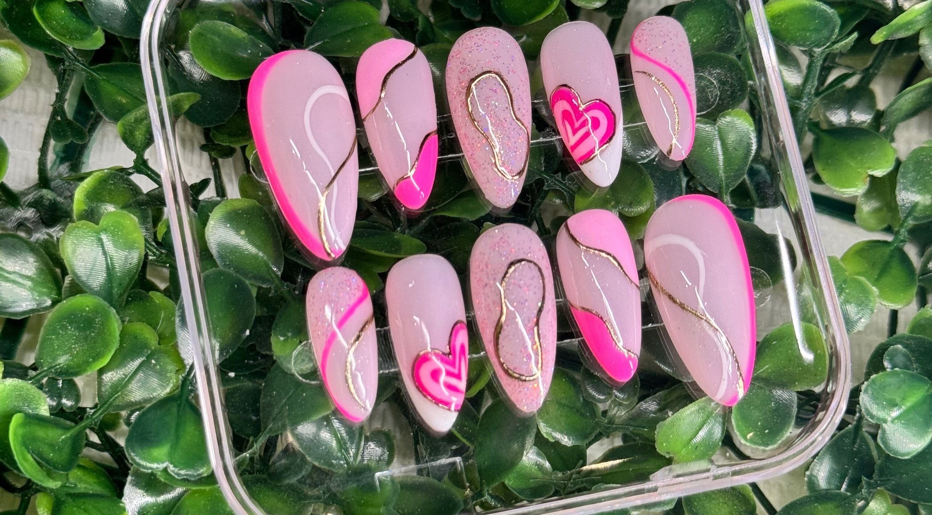 Pink nail art with gold accents at Lara McLeish Beauty Box, Rhiwlas, Wales, GB.