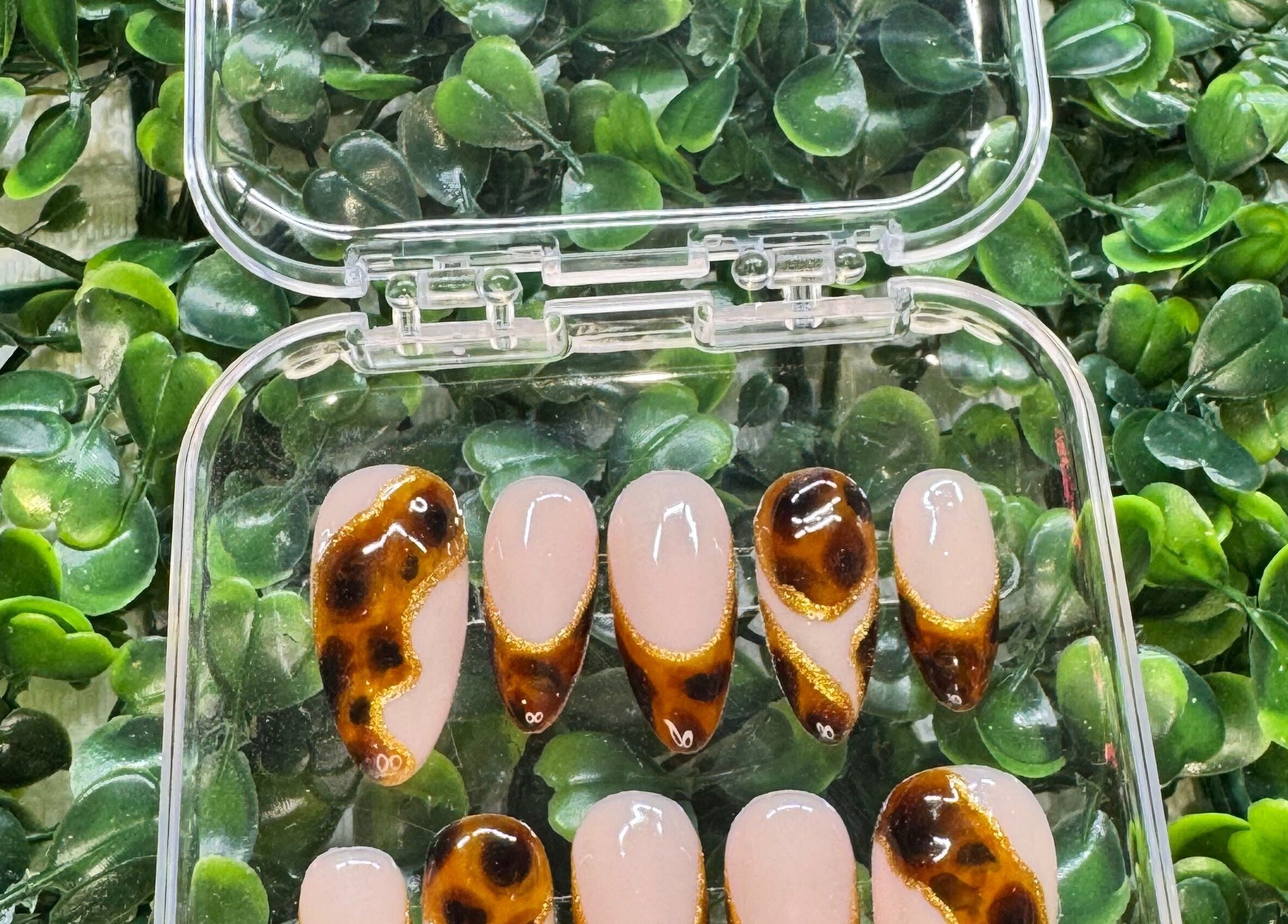 Stylish tortoiseshell nail art display at Lara McLeish Beauty Box, Rhiwlas, Wales, GB.