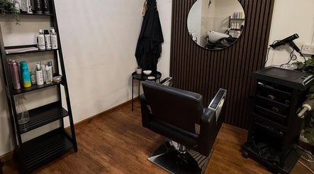 Elegant salon station at Keelys, Faringdon, England, GB, featuring stylish decor and beauty products.