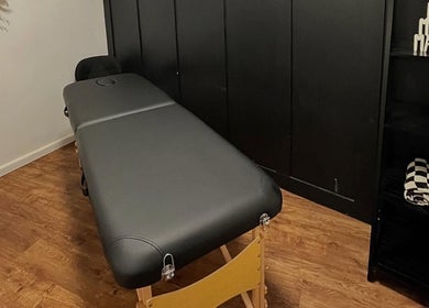Relaxing massage table setup at Keelys in Faringdon, England, GB, highlighting peaceful wellness ambiance.