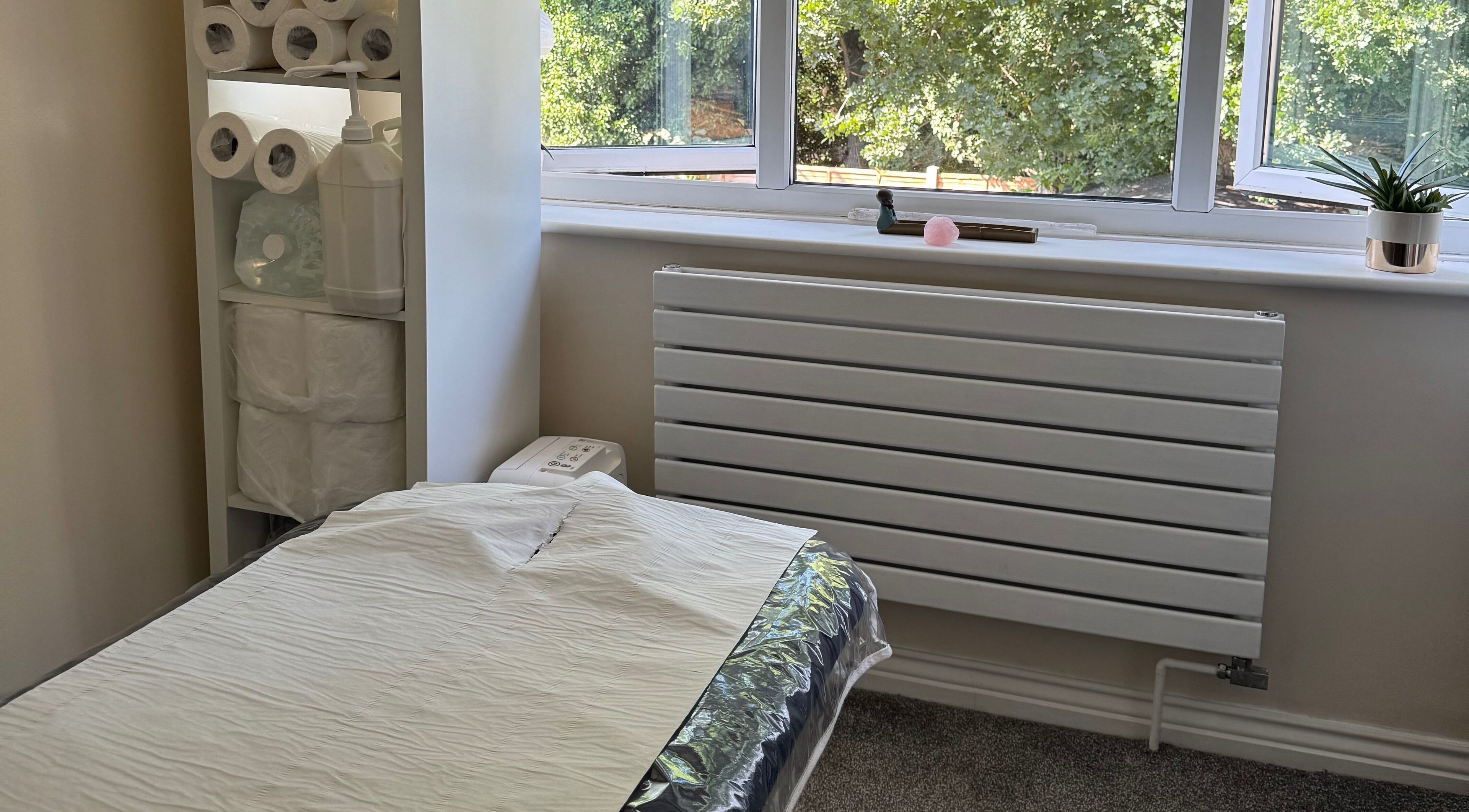 Comfortable treatment room at Benfleet - Kingswood Clinic Clare, Benfleet, Essex, GB with a serene view.